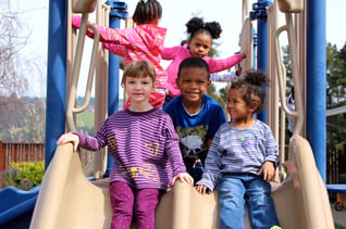 Oakland preschool kids on slide